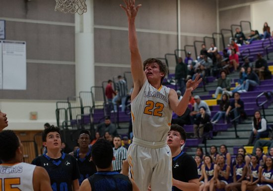Lemoore's Michael Sheldon attempts a shot in Wednesday's loss to Hanford West.